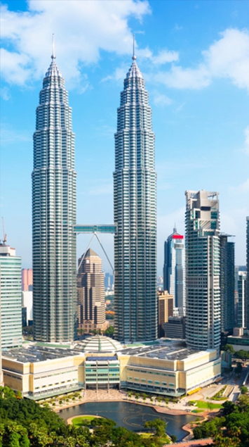 A picture of The Petronas Towers also known as the Petronas Twin Towers and colloquially the KLCC Twin Towers, are an interlinked pair of 88-storey supertall skyscrapers in Kuala Lumpur, Malaysia, standing at 451.9 metres (1,483 feet)